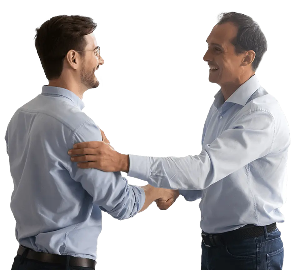 Employees shake hands & pat each other on the shoulder
