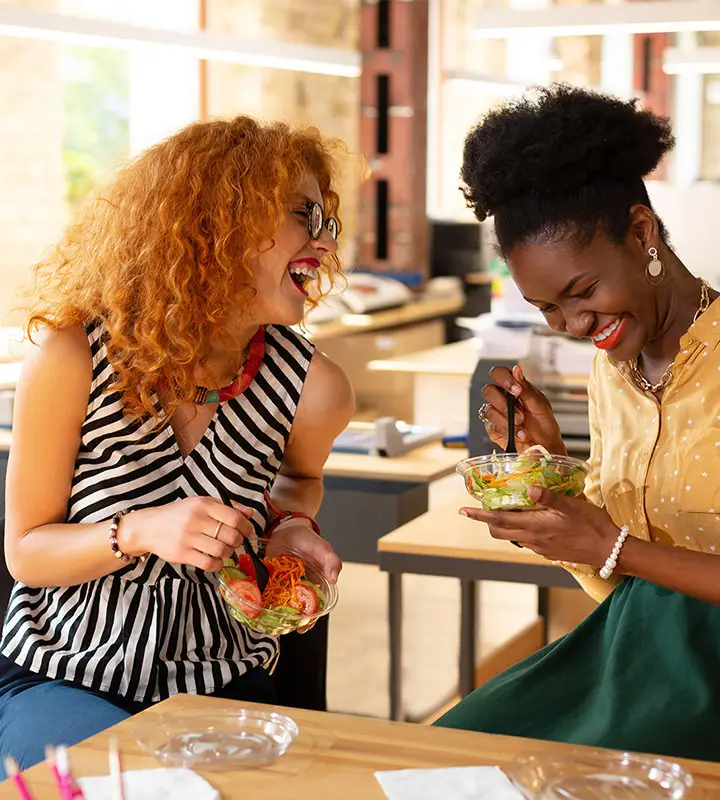 Female employees having a good time while eating